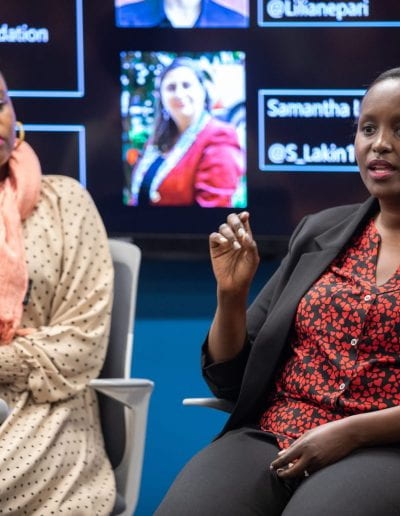 Panelists speaking at How Women Saved Rwanda event